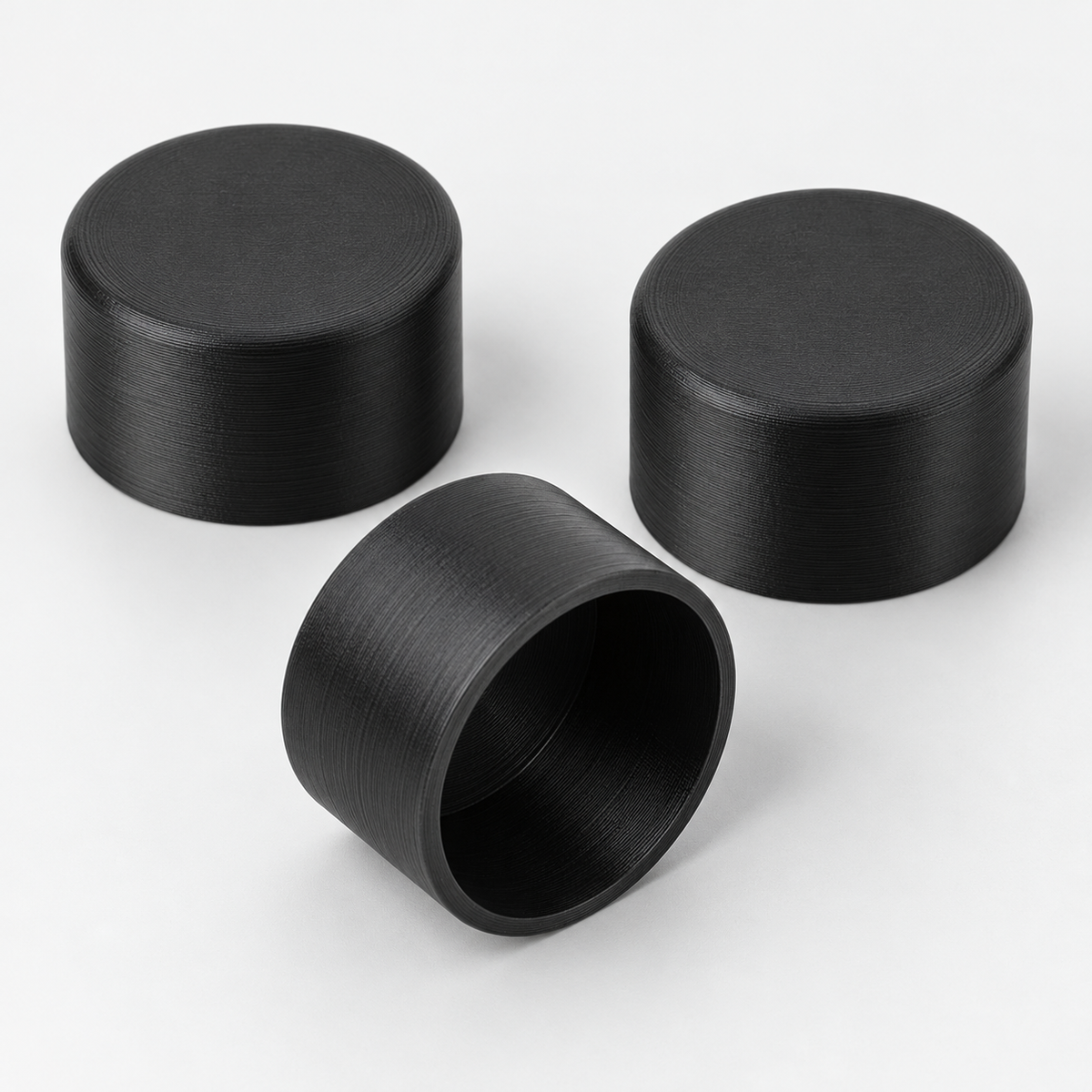 AI-generated illustration of black 25 mm round tube end caps